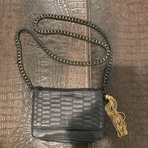 Aimee Kestenberg black wallet on a chain with metal tassel